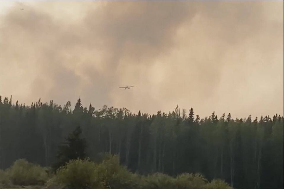 Air support works on the Pelican Lake Fire Thursday, May 18. (Fred Cahoose video screen capture)