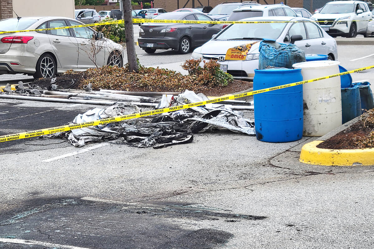 Aftermath of a Saturday morning, May 20 fire that completely destroyed a sales tent and contents and charred the pavement in front of The Brick store in 91原创. (Dan Ferguson/91原创 Advance Times)