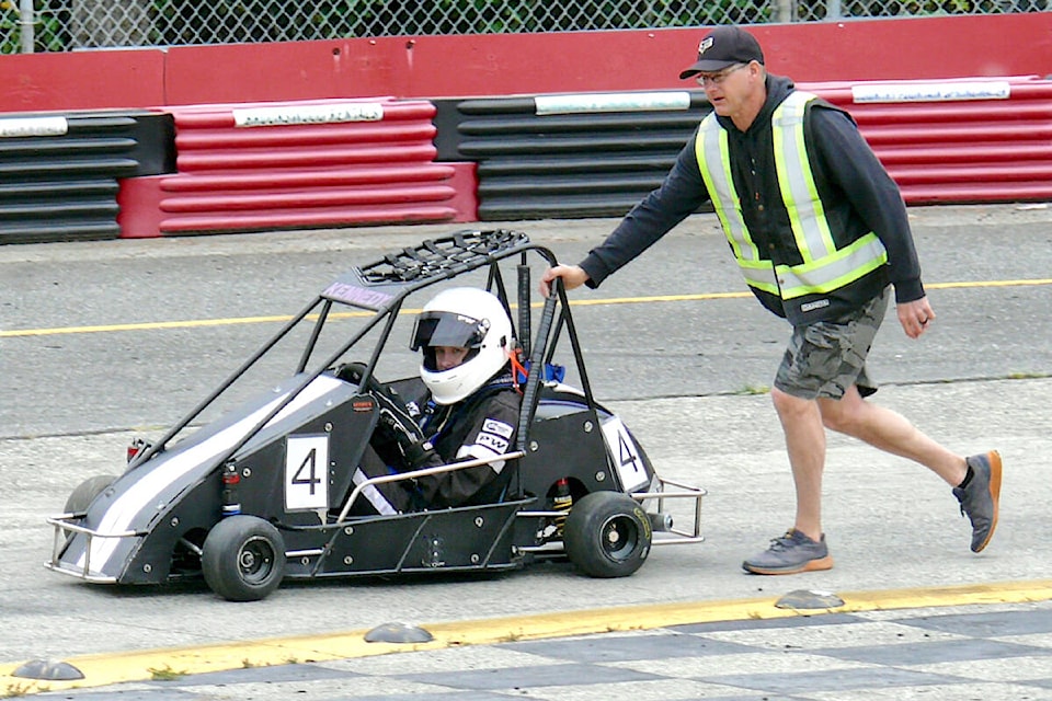 A driver needed a push after spinning out at the 91ԭ Quarter Midget Association track. Racing mixed with fundraising Sunday, May 21 as an LQMA raffle and race raised $4,000 for Autism B.C. (Dan Ferguson/91ԭ Advance Times)