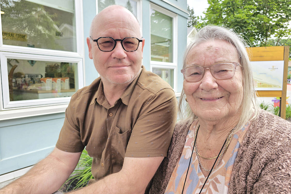 David Riek, with his mother Anneliese at The Village Langley on Saturday, May 27, when a group of villagers raised $401 for the Alzheimer Society of B.C. (Dan Ferguson/Langley Advance Times)