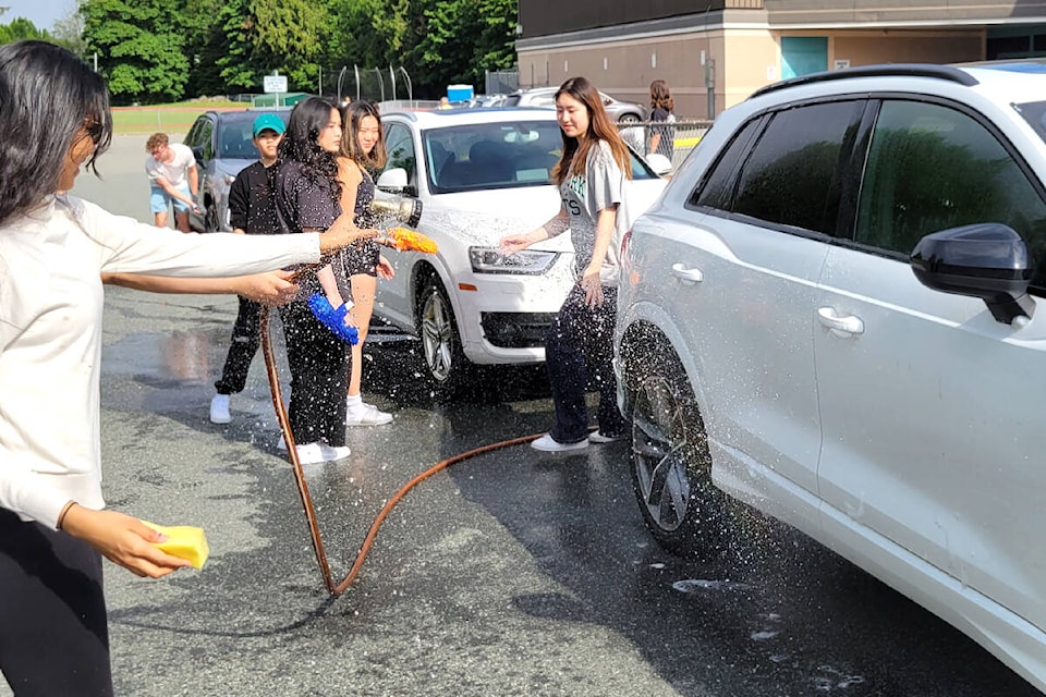 WGSS Grade 12 students washed cars by donation to raise funds for their dry grad on Saturday, May 27. (Kyler Emerson/Langley Advance Times)