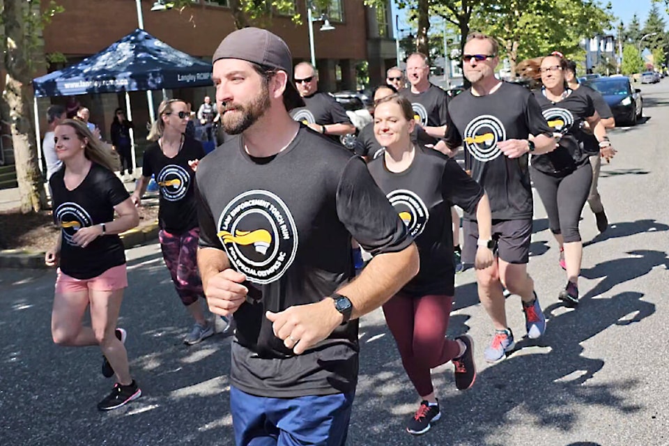 About two dozen runners turned out for the return of the Law Enforcement Torch Run for Special Olympics BC in 91ԭ on Tuesday, June 6. (Dan Ferguson/91ԭ Advance Times)