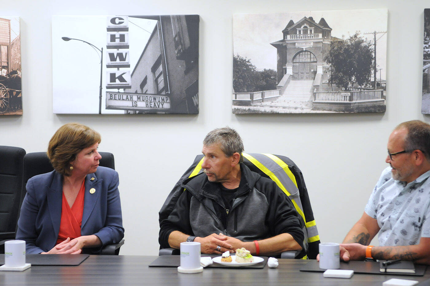 Paul Larson, member of the Downtown Chilliwack Street Team, speaks with minister of social development and poverty reduction, Sheila Malcolmson, as executive director of Ruth and Naomi聮s, Scott Gaglardi, listens during a funding announcement in Chilliwack on Tuesday, June 13, 2023. (Jenna Hauck/ Chilliwack Progress)