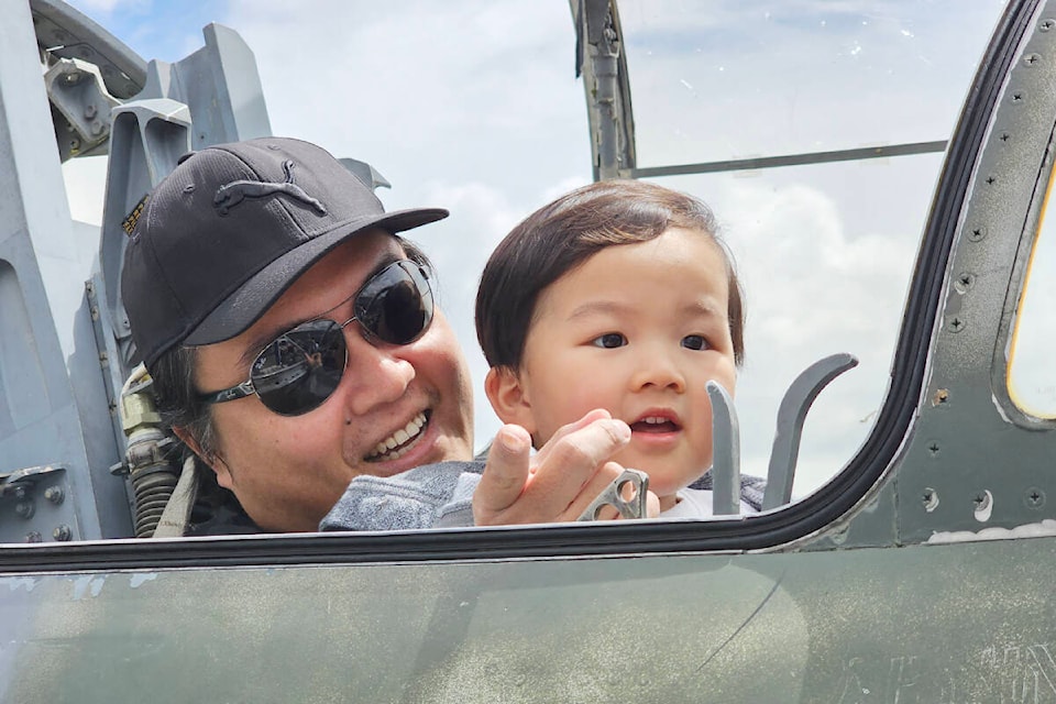 Jeremy Chin and son Ethan, 3, from Burnaby, got to try out the view from a jet fighter pilot’s seat Sunday, June 18, at the Canadian Museum of Flight in Langley, which was celebrating Father’s Day by offering free admission to dads of all ages, with at least one paid admission. (Dan Ferguson/Langley Advance Times)