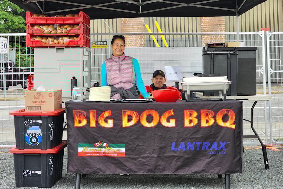 Kevin Legge of Big Dog BBQ (seated) won the Meat in the Street competition in Aldergrove on Saturday, June 17 at the plaza, a fundraiser for the Starfish Backpack program, run by Rotary and serving four Aldergrove schools. (Dan Ferguson/91ԭ Advance Times)