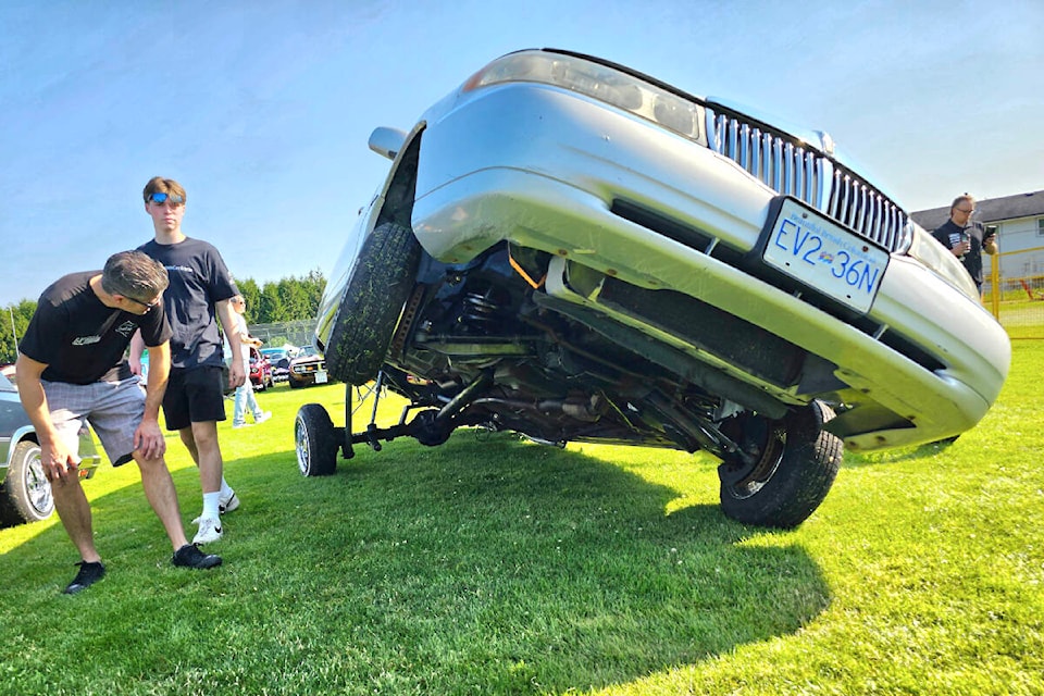 One of several cars with an extreme suspension system drew attention at the fifth Stay Gold car show and fundraiser held Sunday, June 25 at H.D. Stafford Middle School in 91ԭ City. (Dan Ferguson/91ԭ Advance Times)