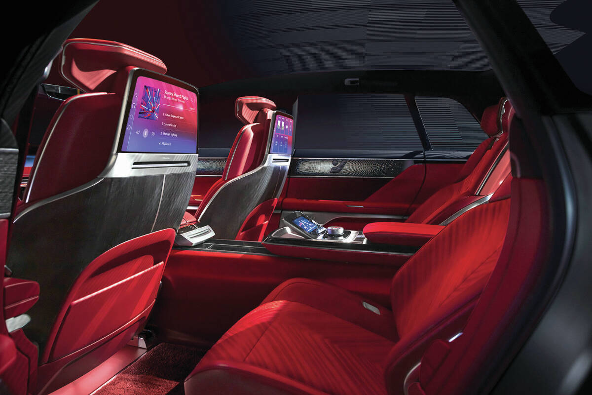 The two-place rear seat provides beautifully integrated seatback entertainment screens and a control display in the console. PHOTO: CADILLAC