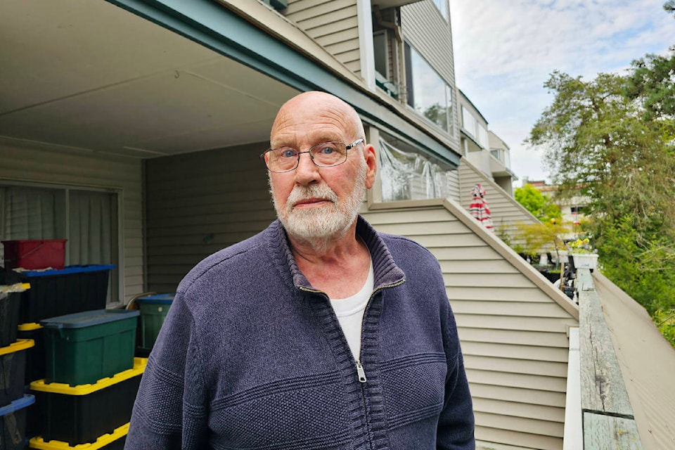 Cran Campbell has storage boxes stacked on his balcony. When the Langley City resident heard that the building was slated to be demolished, he started packing. (Dan Ferguson/Langley Advance Times)
