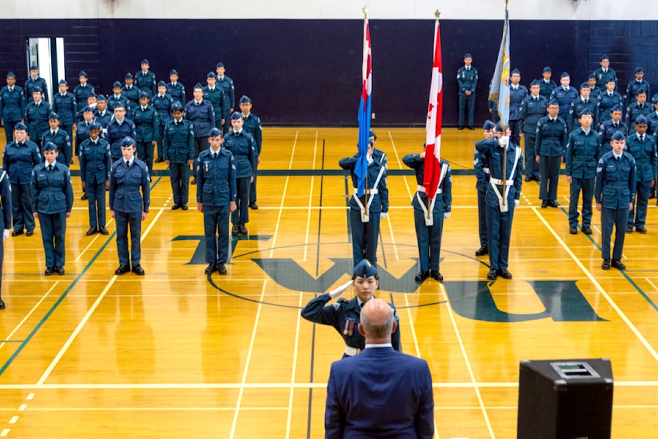 Parade opening with WO1 Stella Song saluting reviewing officer MP Tako van Popta. (Sgt. Andrea Olivier/Special to 91ԭ Advance Times)
