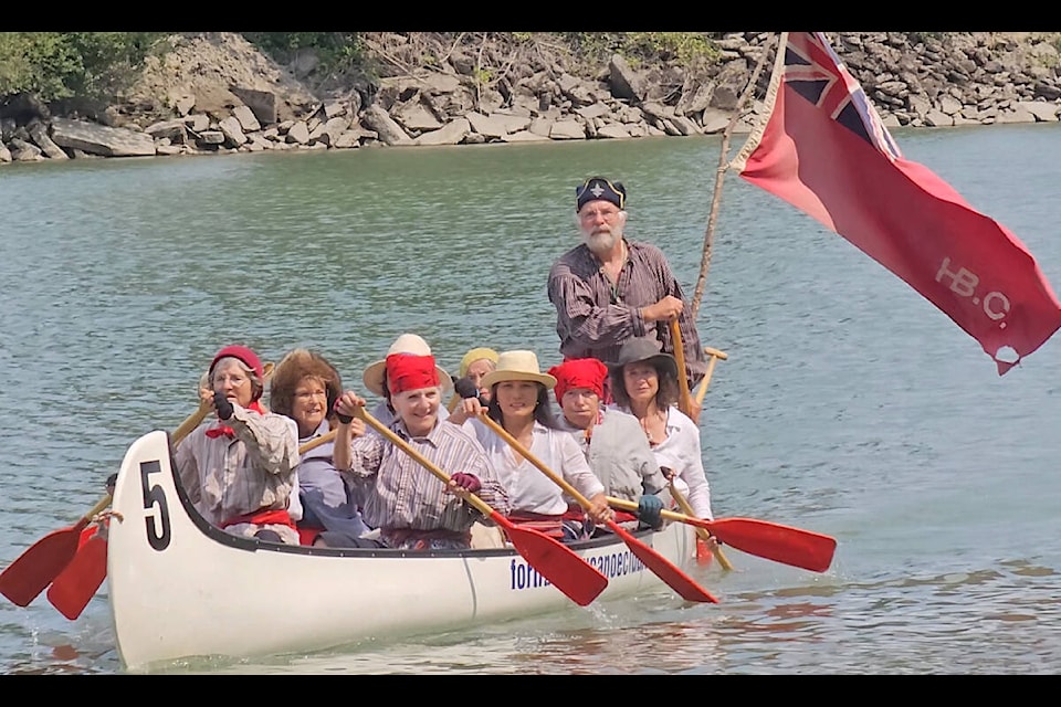 B.C. Day wound down in Fort 91ԭ with the annual Brigade Days re-creation of fur traders paddling to the historic fort on Monday, Aug. 7. Murrayville resident Jonathan Wilkins at the back, standing, was chef de Voyageur of one vessel. (Dan Ferguson/91ԭ Advance Times)