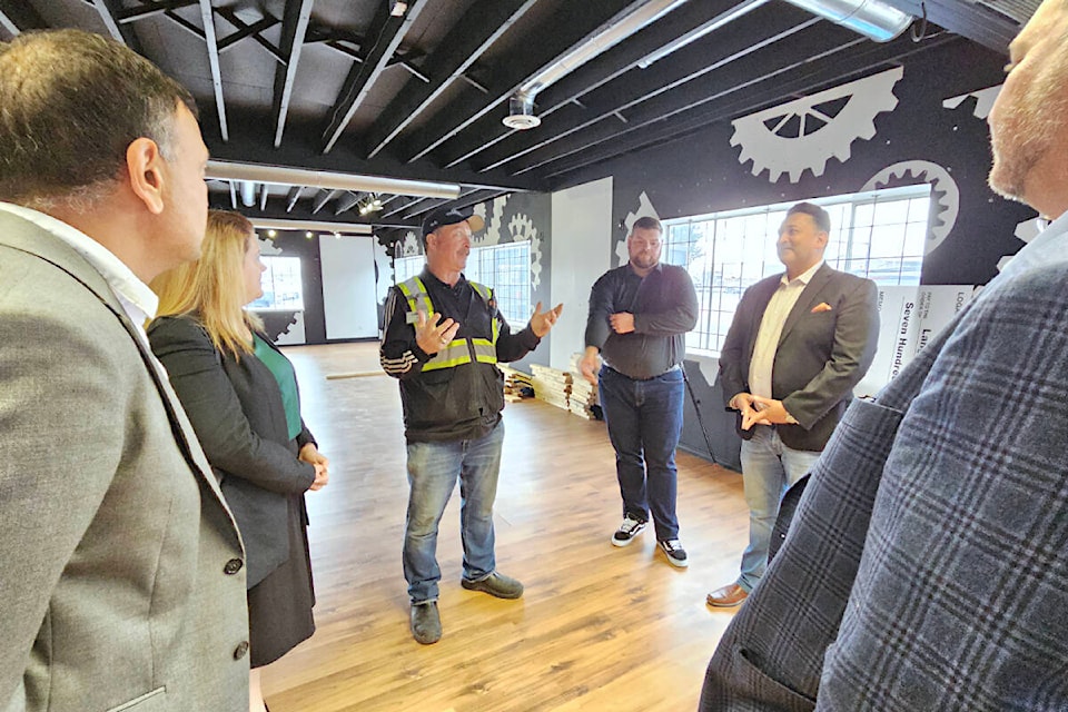 Jim Calamunce, executive director of the 91ԭ Food Bank (centre), showed some benefactors around the charity’s new 91ԭ City space on Wednesday, Aug. 9. Three businesses helped make the purchase possible with donations of close to $800,000 in total. (Dan Ferguson/91ԭ Advance Times)