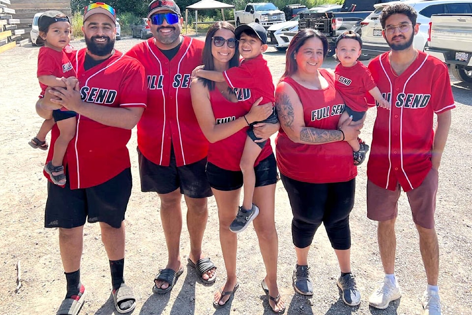 The Mangat family, lead by Jodi (third from right) are organizing their fourth softball tournament in Aldergrove to support families battling childhood cancer on Aug. 24 and 25. (Special to The Star)
