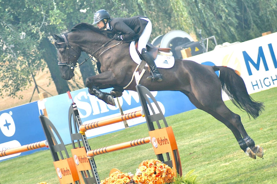 91ԭ’s Tiffany Foster and Battlecry finished third in the CSI3* ATCO Cup Grand Prix 1.50m on Sunday, Aug. 20 at Thunderbird Show Park. (Dan Ferguson/91ԭ Advance Times)