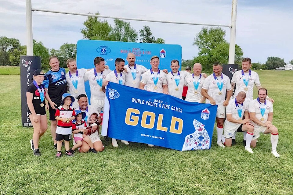 Langley firefighter Beau Parker (3rd from left, standing) won gold playing men’s rugby sevens and men’s singles pickleball, and also picked up a silver in men’s doubles pickleball at the World Police and Fire Games, which ran from July 28 to Aug. 6 in Winnipeg. (Special to Langley Advance Times)