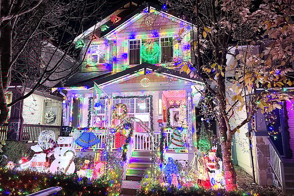Thousands of Christmas lights adorn the home of Earl Thurston and Rick Evans. 