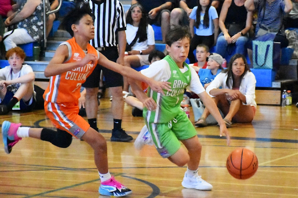 The three-on-three tournament is popular with players, and seen here is a tough Vancouver Island-Central Coast team (green) against Fraser River.
