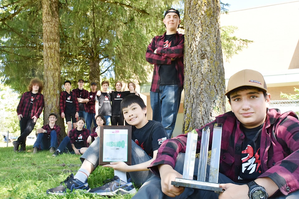 Members of the Thomas Haney Secondary School's ThunderTech Robotics team with the Innovation In Control Award they won at the FIRST Robotics Competition Canadian Pacific Regional 2024.  