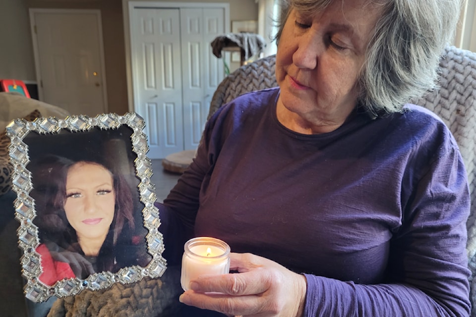 Debbie Harbowy with a photo of her missing daughter Rebecca.