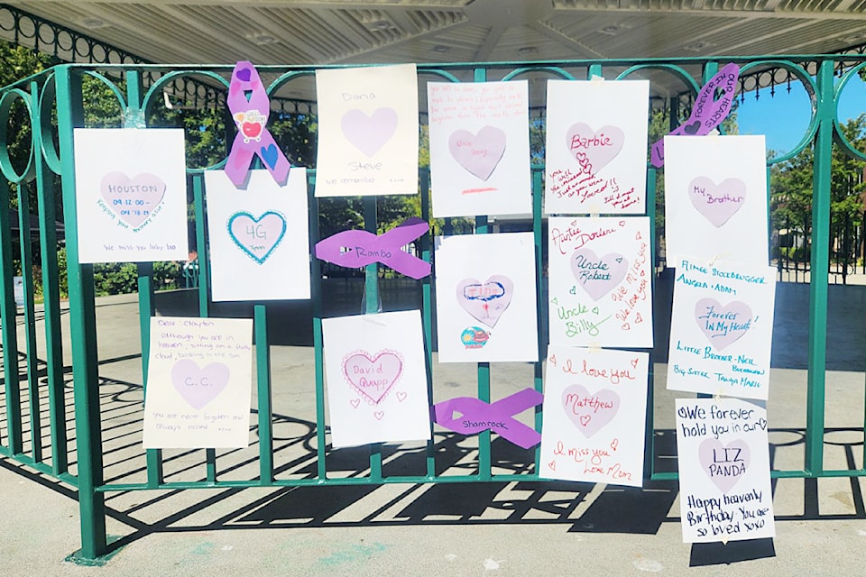 Messages of love for people who lost their lives to illicit drugs adorn the bandstand in Memorial Peace Park. 