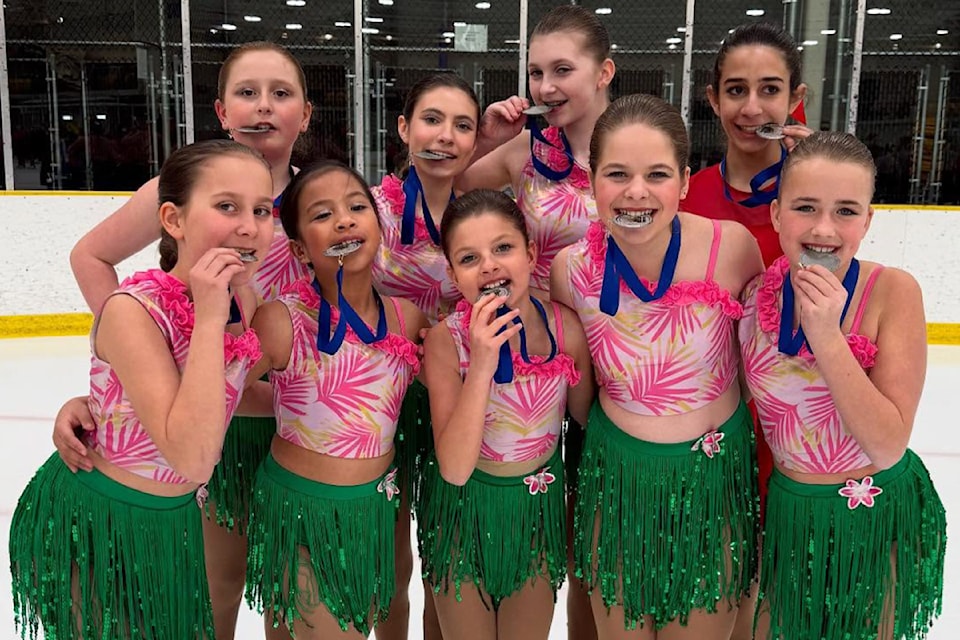 The Maple Ridge Skating Club's juvenile team with their medals.