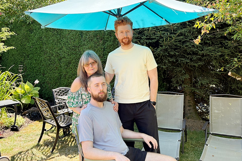 Michele White with her sons Trevor, and Zac, right. 