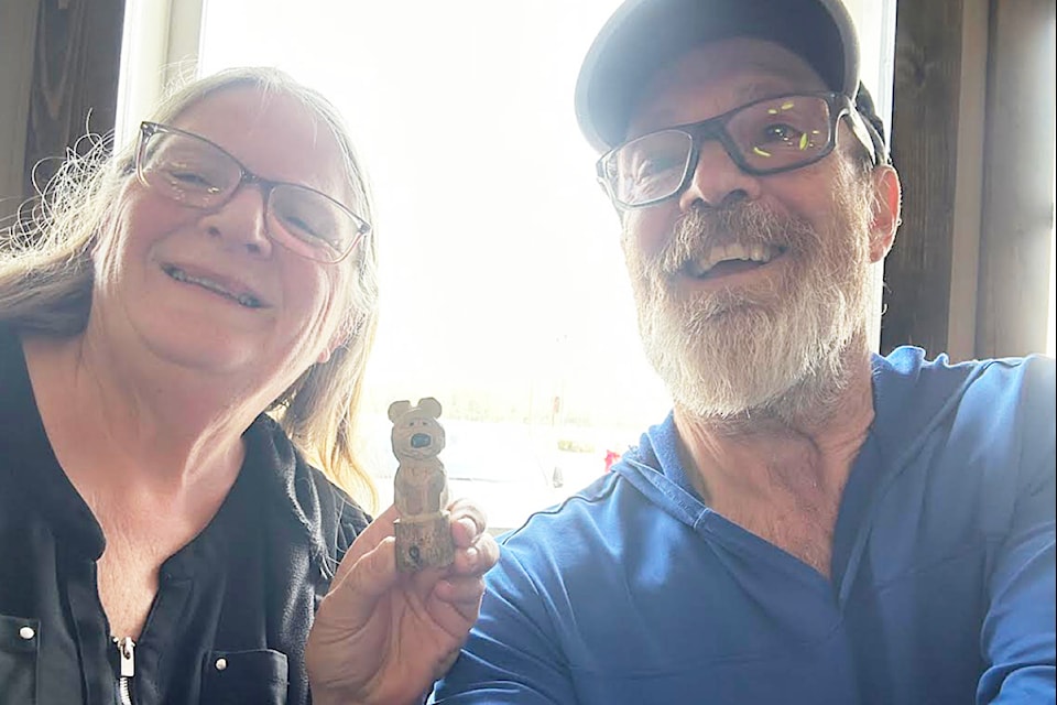 Kevin Binnie, right, with June, who he met in Manitoba with his wood-carved bear, "Binnie the Poo".