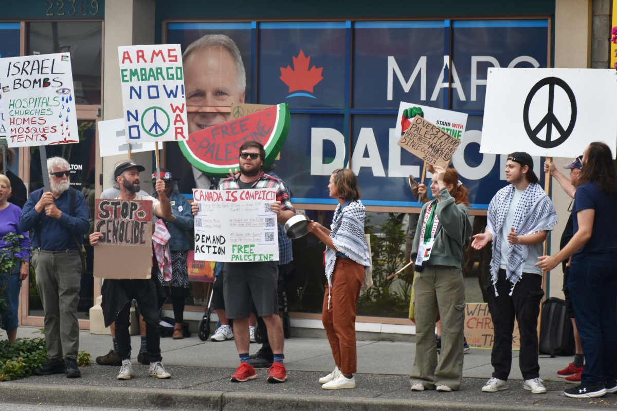 Rally against genocide outside MP's office in Maple Ridge