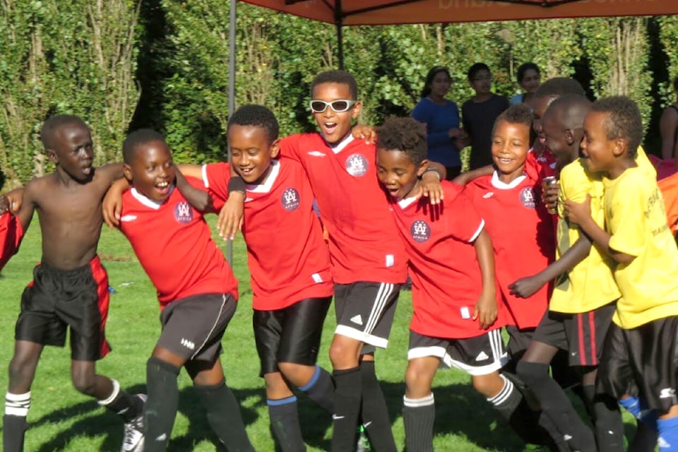 Africa United FC celebrated winning the youths tournament at the African Nations Sports & Culture Festival in Burnaby in 2005, T.J. Tahid among the players.