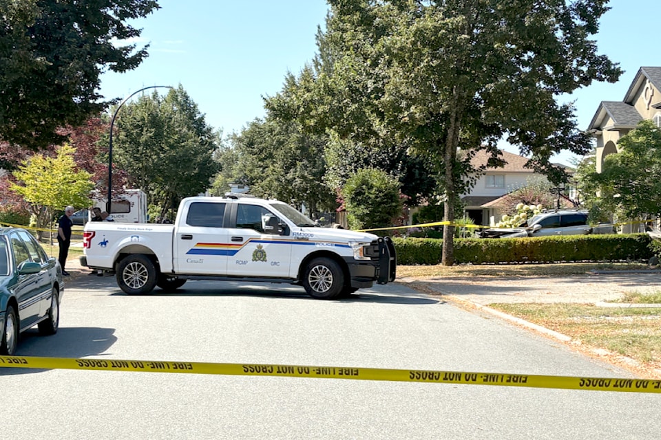 Police tape is still up in an Albion neighbourhood were three people were found dead Wednesday night.