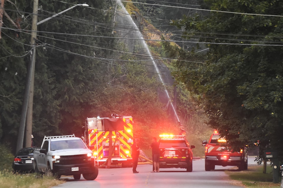 Firefighters controlling a rural fire in Pitt Meadows