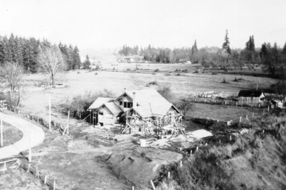 This picture captures the transition between the McIver family farm and building of the Maple Ridge Golf Course, which opened Labour Day 1925. The first club house is visible in the distance, while Doan Hartnell house is nearing completion in the foreground, and there's a good view of another house in the neighbourhood. (P03765)