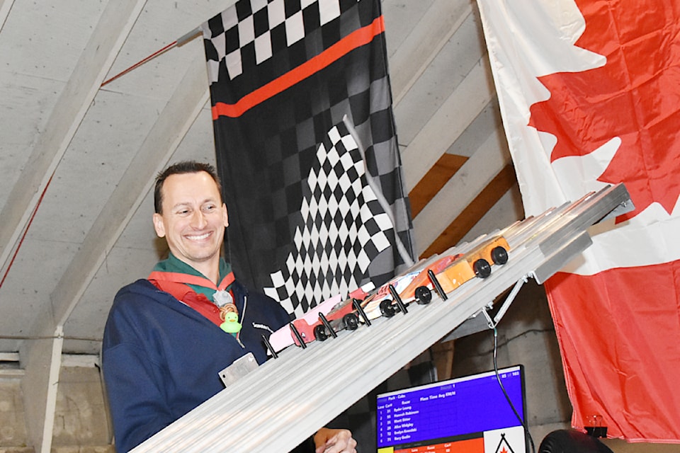 Scouter Ryan Swire made sure the kub kars were ready before releasing them down the track during the 2025 Scouts Canada Three Rivers Rally Day at the Ridge Meadows Home Show this year. 
