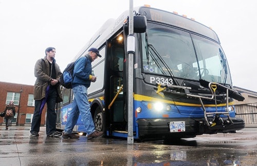 Passengers board the 701 bus at the Haney Bus Exchange Thursday morning.