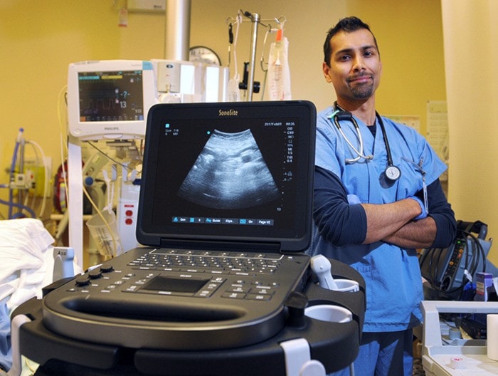 Dr. Ravi Rughani with new ultra sound machine at Ridge Meadows Hospital.