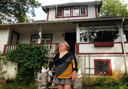 Yvonne Willems outside her home.