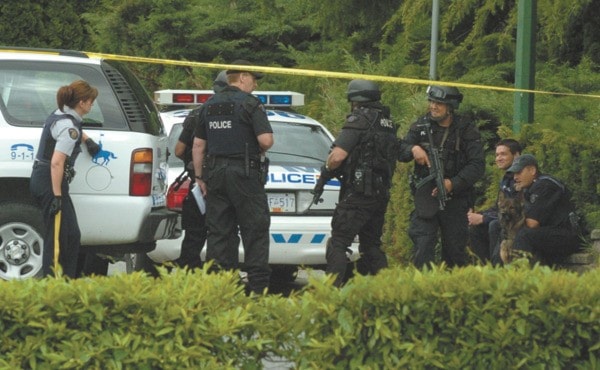 ERT members wait at 202nd Street at Dewdney Trunk street.