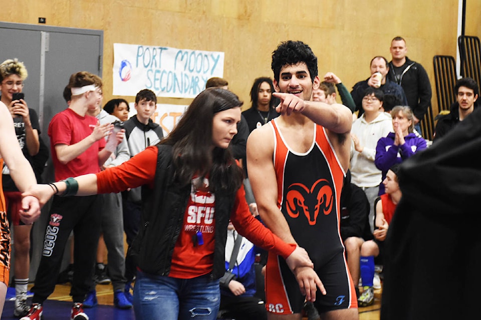 Maple Ridge Secondary’s Kasra Tabatabaei points to a friend in the crowd after a hard fought first round victory in his home gym. (Ronan O’Doherty photos - THE NEWS)