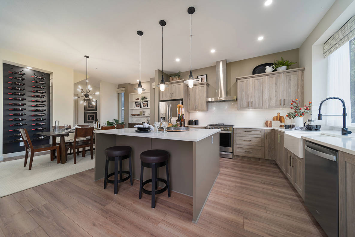 Open-concept plans include huge kitchen islands meant for eating, entertaining or just hanging out together.