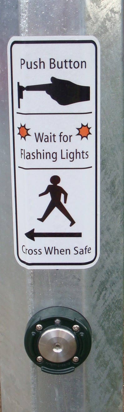 23403479_web1_crosswalk-push-sign