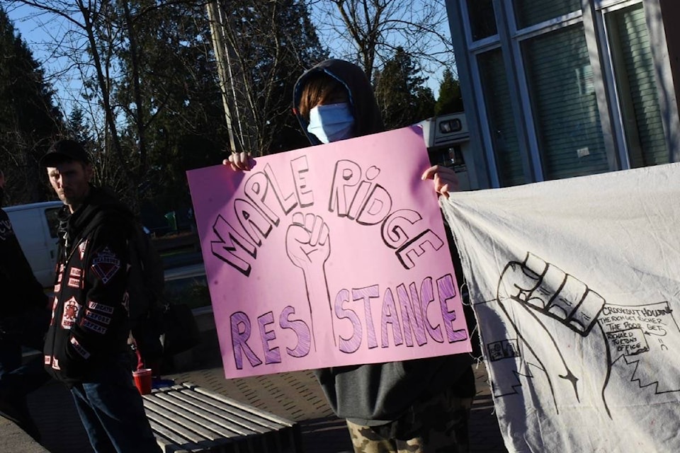 Protestors stand outside Alouette Heights Wednesday afternoon. (Colleen Flanagan/The News)