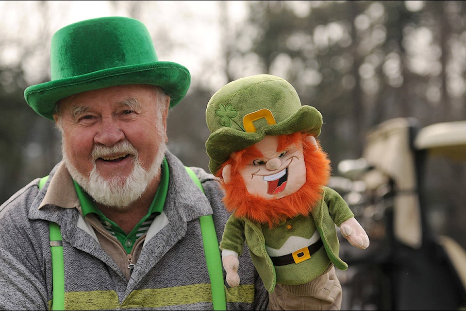Patrick O’Shea holds up his leprechaun golf head cover during a round of golf at Meadowlands Golf and Country Club on St. Patrick’s Day on March 17, 2021. (Jenna Hauck/ Chilliwack Progress)