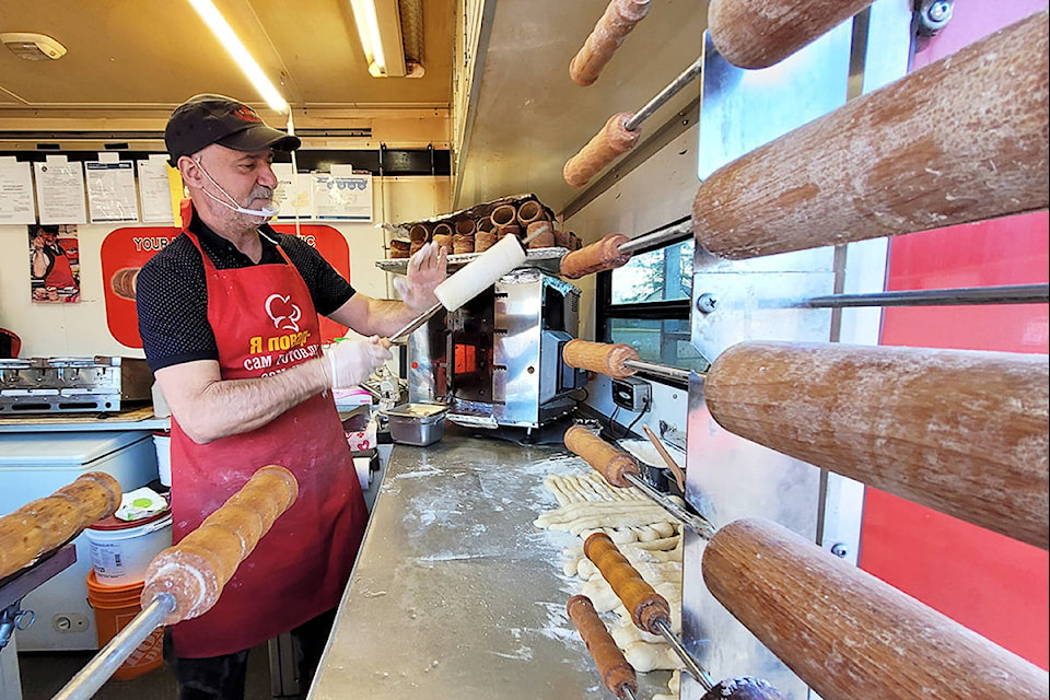 Raphael Baruh of Slavic Rolls creates one of his Eastern European desserts at the Maple Ridge food truck festival on Saturday afternoon. (Neil Corbett/The News)