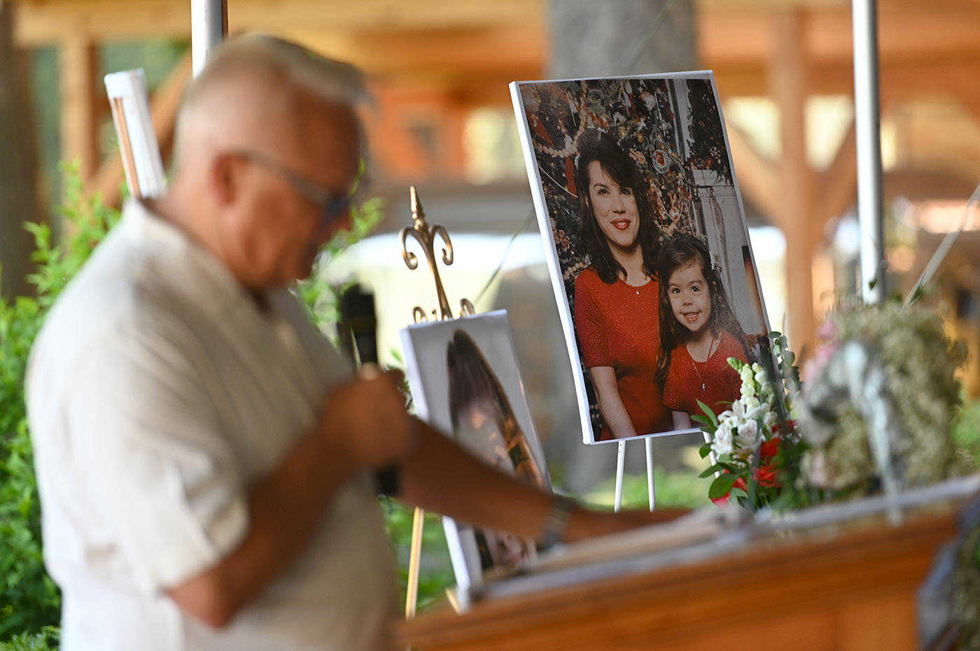 A photo of Shaelene Bell when she was a child with her mother, Alina Durham, sits on a table during Bells celebration of life at Sandpiper Resort on Saturday, June 26, 2021. (Jenna Hauck/ Chilliwack Progress)