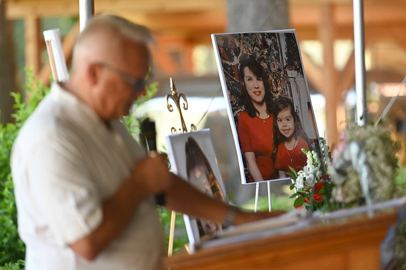A photo of Shaelene Bell when she was a child with her mother, Alina Durham, sits on a table during Bells celebration of life at Sandpiper Resort on Saturday, June 26, 2021. (Jenna Hauck/ Chilliwack Progress)