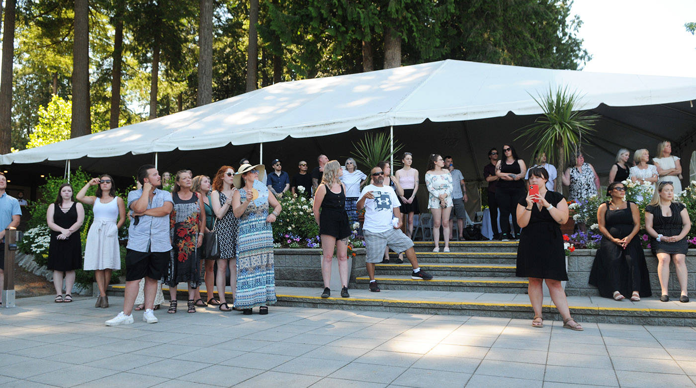 Friends and family of Shaelene Bell watch as two released doves fly above during her celebration of life at Sandpiper Resort on Saturday, June 26, 2021. (Jenna Hauck/ Chilliwack Progress)