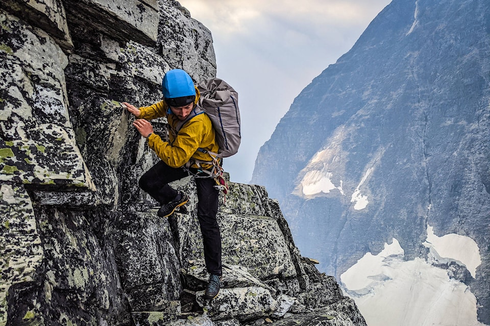 Leif Godberson down-climbing Uto Peak with Mount Sir Donald in the background. (Contributed-Eric Carter)