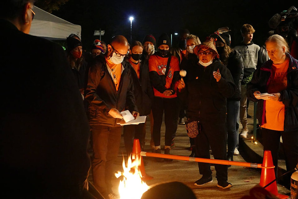 An Elder from Katize First Nation said a prayer during the letter-burning ceremony at the vigil held in Memorial Peace Park. (Priyanka Ketkar/The News)