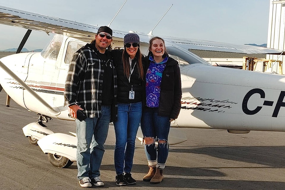 Shari Morrison, with the two of the people she brought back from Hope in her Cessna on Wednesday. (Special to The News)