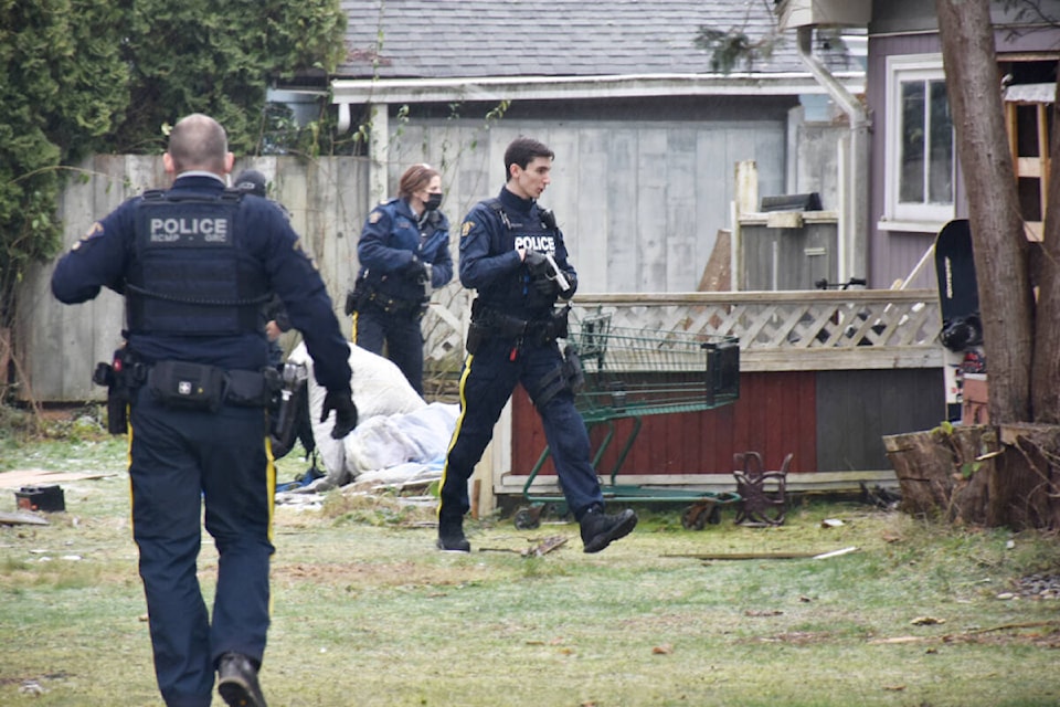 Police surround a house after a stabbing in Maple Ridge. (Colleen Flanagan/The News)