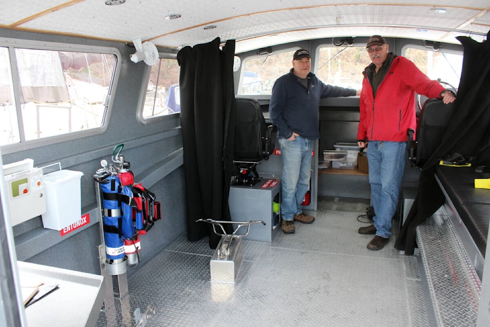 Brian Francoeur, left, and Harman Bootsma inside the Island Responder. (Photo by Don Bodger)